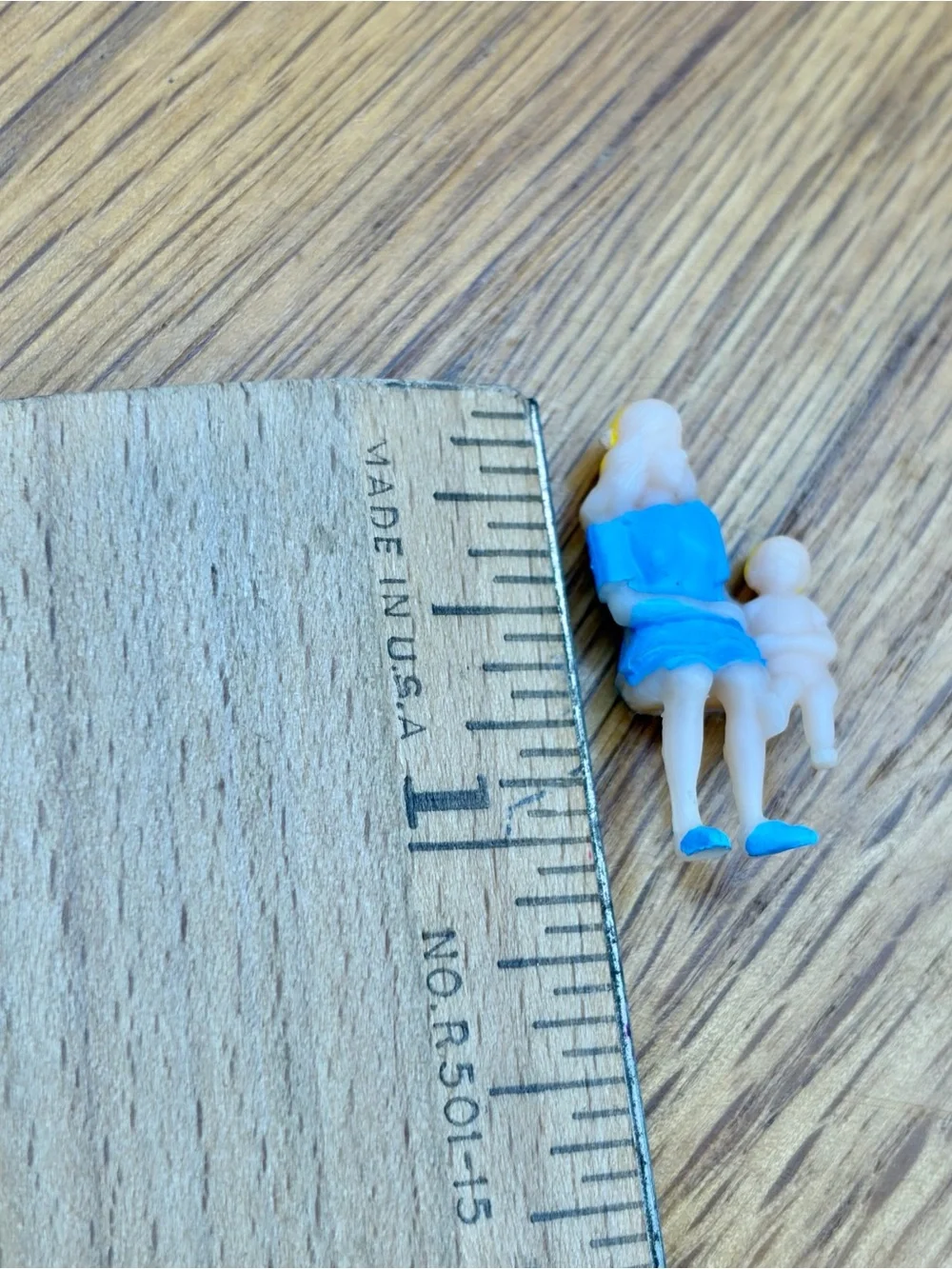 Vintage Plastic Celluloid Painted Woman Holding Child Figure Sitting Trinket 1”